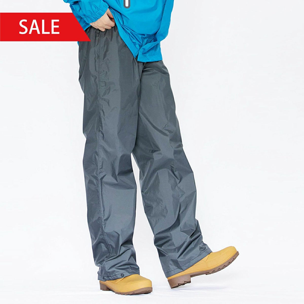 着用イメージ：チャコール［女性モデルのサイズ］身長:168cm 着用サイズ：M　※写真は7720 KJ レインパンツとなります。当商品「7730 EX」は、さらにフロントにはボタンとファスナー、裾にはファスナーがつき調整可能です。